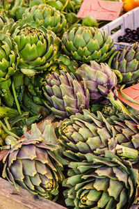 High angle view of artichokes for sale at market stall