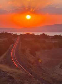 Scenic view of landscape against sky during sunset