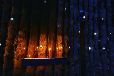 Full frame shot of illuminated lights hanging on wall