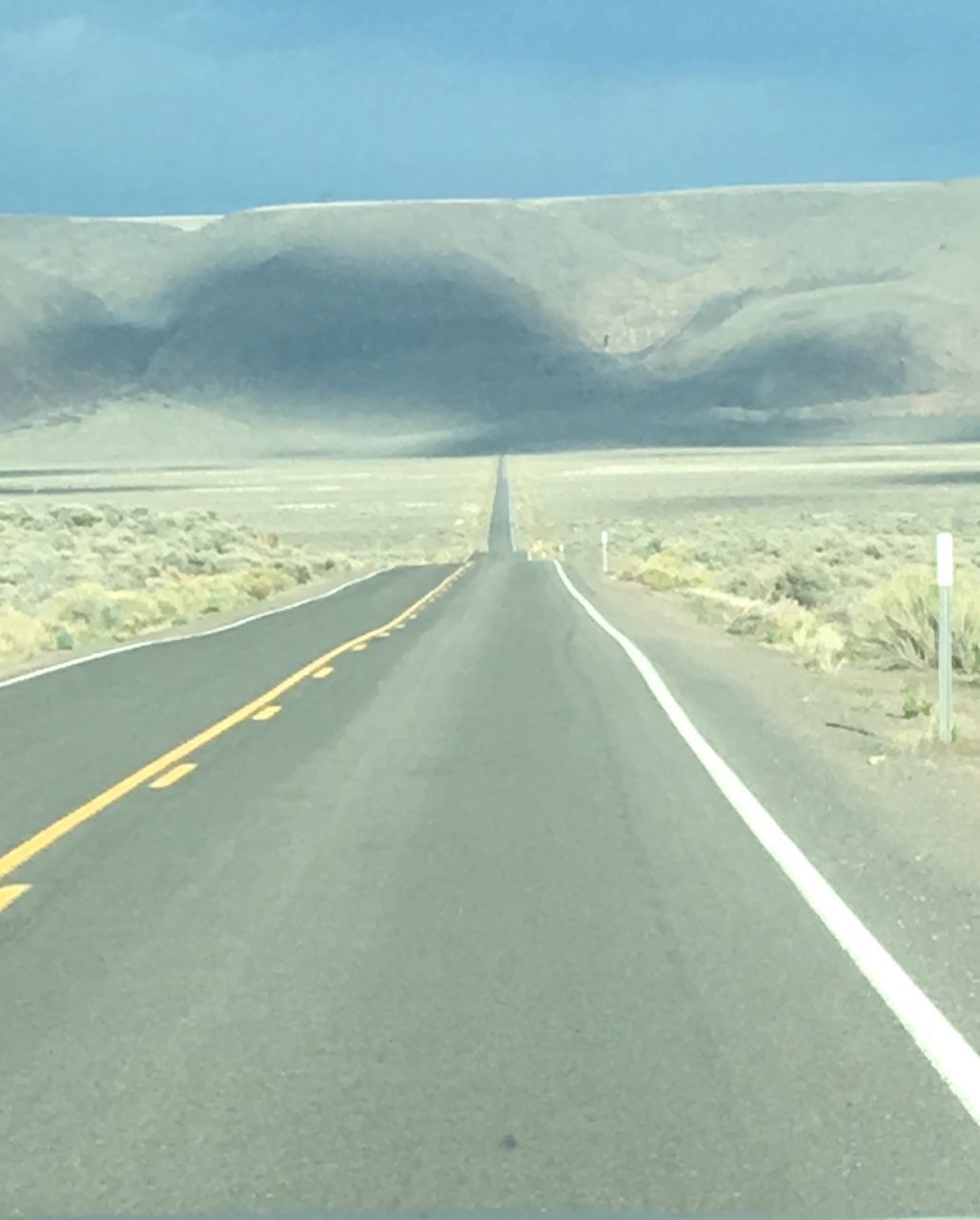 EMPTY ROAD AMIDST LANDSCAPE