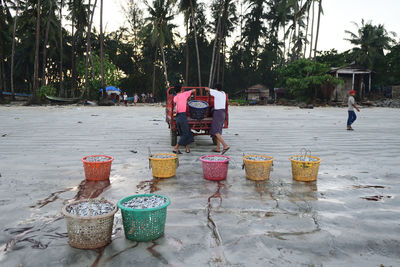 Group of people for sale at street market