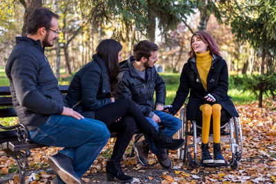 Young couple sitting in park