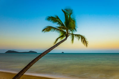 Scenic view of calm sea against clear blue sky