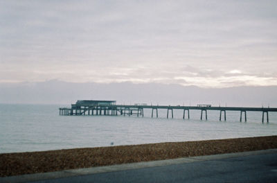 Pier over sea against sky