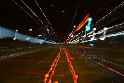 Light trails against sky at night