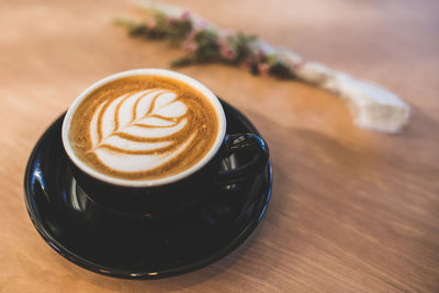 Close-up of cappuccino on table