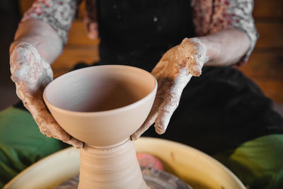 Midsection of man preparing food