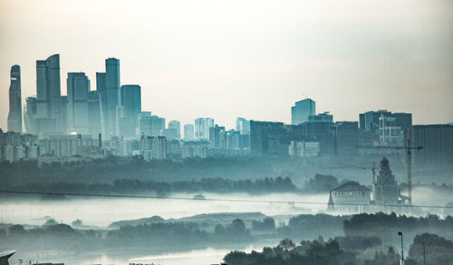 Buildings in city against sky