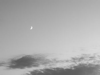 Low angle view of moon in sky at night