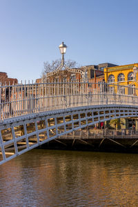 Bridge over river with buildings in background