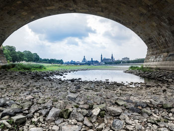 View of bridge against cloudy sky