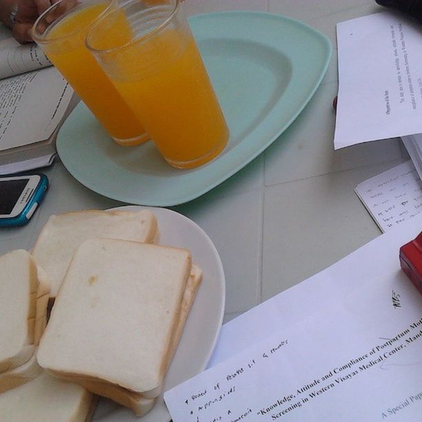 indoors, food and drink, table, still life, freshness, food, high angle view, drink, refreshment, close-up, paper, book, plate, no people, healthy eating, coffee cup, fork, education, cropped, ready-to-eat