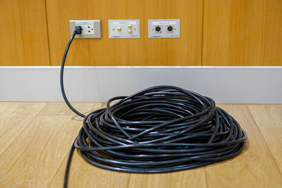 Close-up of telephone booth on hardwood floor