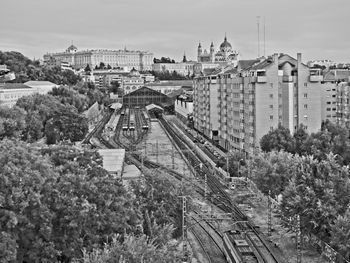 High angle view of railroad tracks amidst buildings in city