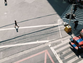 High angle view of boy walking on road