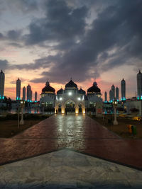 View of buildings against sky at sunset