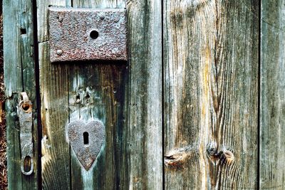 Heart shape keyhole on wooden door