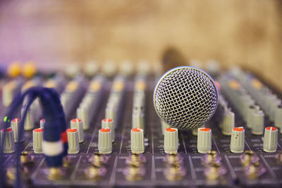 Close-up of microphone on a mixing equipment