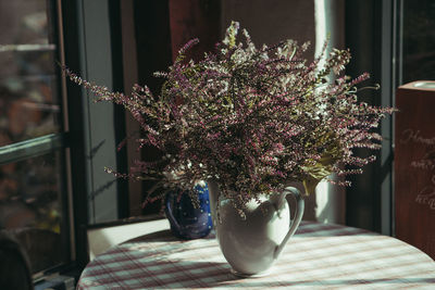 Close-up of flower pot on table