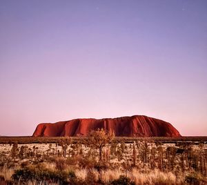 Rock formations on mountain against clear sky