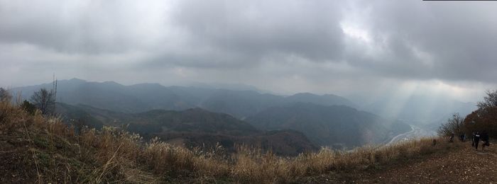 Panoramic view of mountains against storm clouds