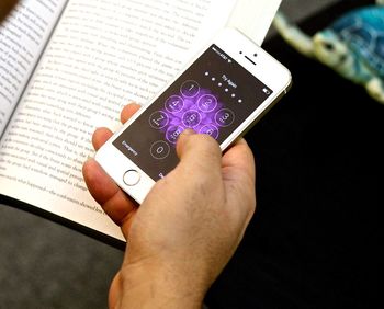 Cropped image of woman holding smart phone