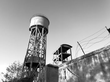 Low angle view of water tower against clear sky