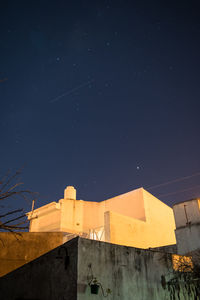 Low angle view of house against sky at night