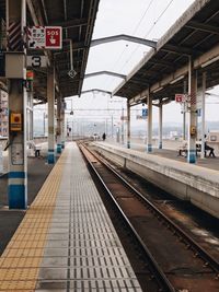 Railroad station platform against sky