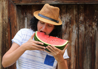 Woman eating watermelon slice