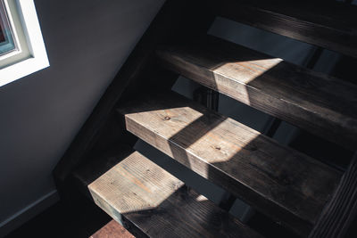 High angle view of sunlight wooden steps at home