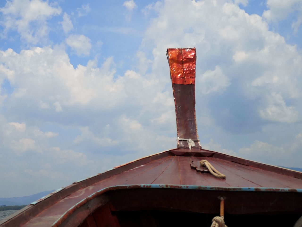 LOW ANGLE VIEW OF OLD TOWER AGAINST CLOUDY SKY