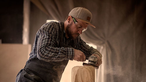 Carpenter working at workshop