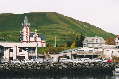 View on the church in husavik with a mountain on the background