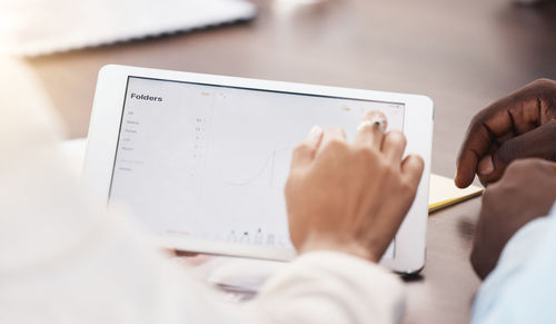 Midsection of man using laptop