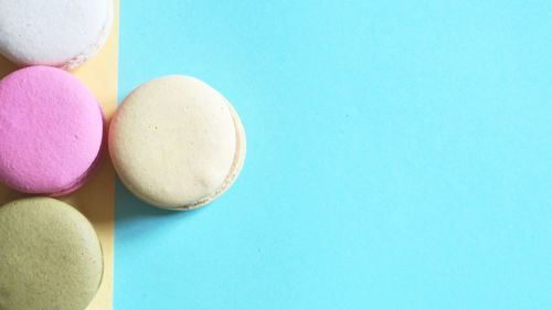 High angle view of macarons on blue background