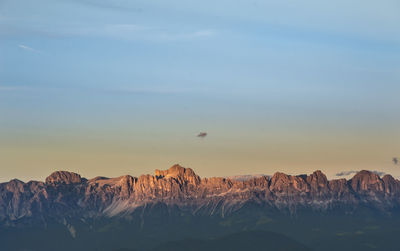 Scenic view of mountains against sky during sunset