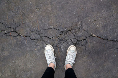 Low section of person standing on street