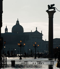 St mark cathedral by grand canal against sky