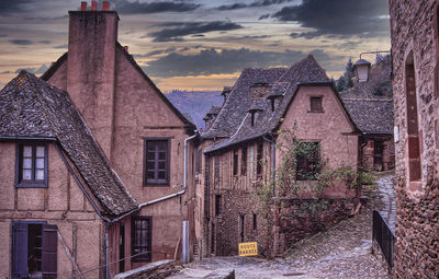 Old building in town against sky