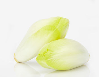 Close-up of bananas against white background