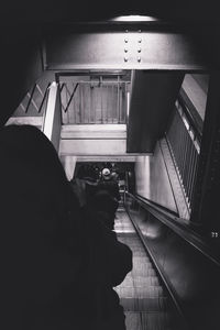 Rear view of man standing in tunnel