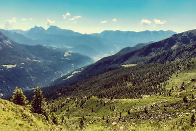 Scenic view of landscape and mountains against sky