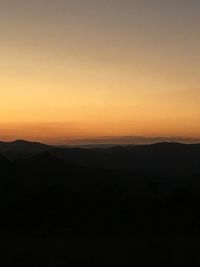 Scenic view of silhouette landscape against sky during sunset