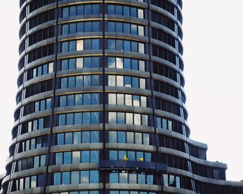 Low angle view of office building against sky