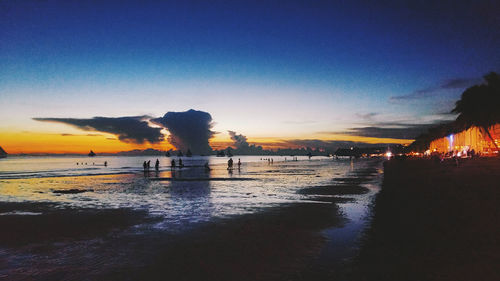 Scenic view of sea against clear sky at sunset