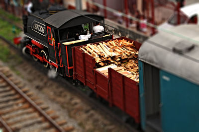 Tilt-shift image of locomotive on railroad tracks