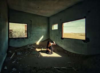 Man sitting by window