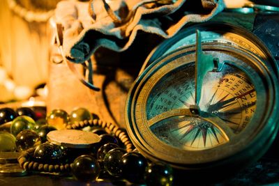 Close-up of vintage navigational compass on table