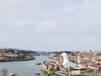 High angle view of harbor by sea against sky